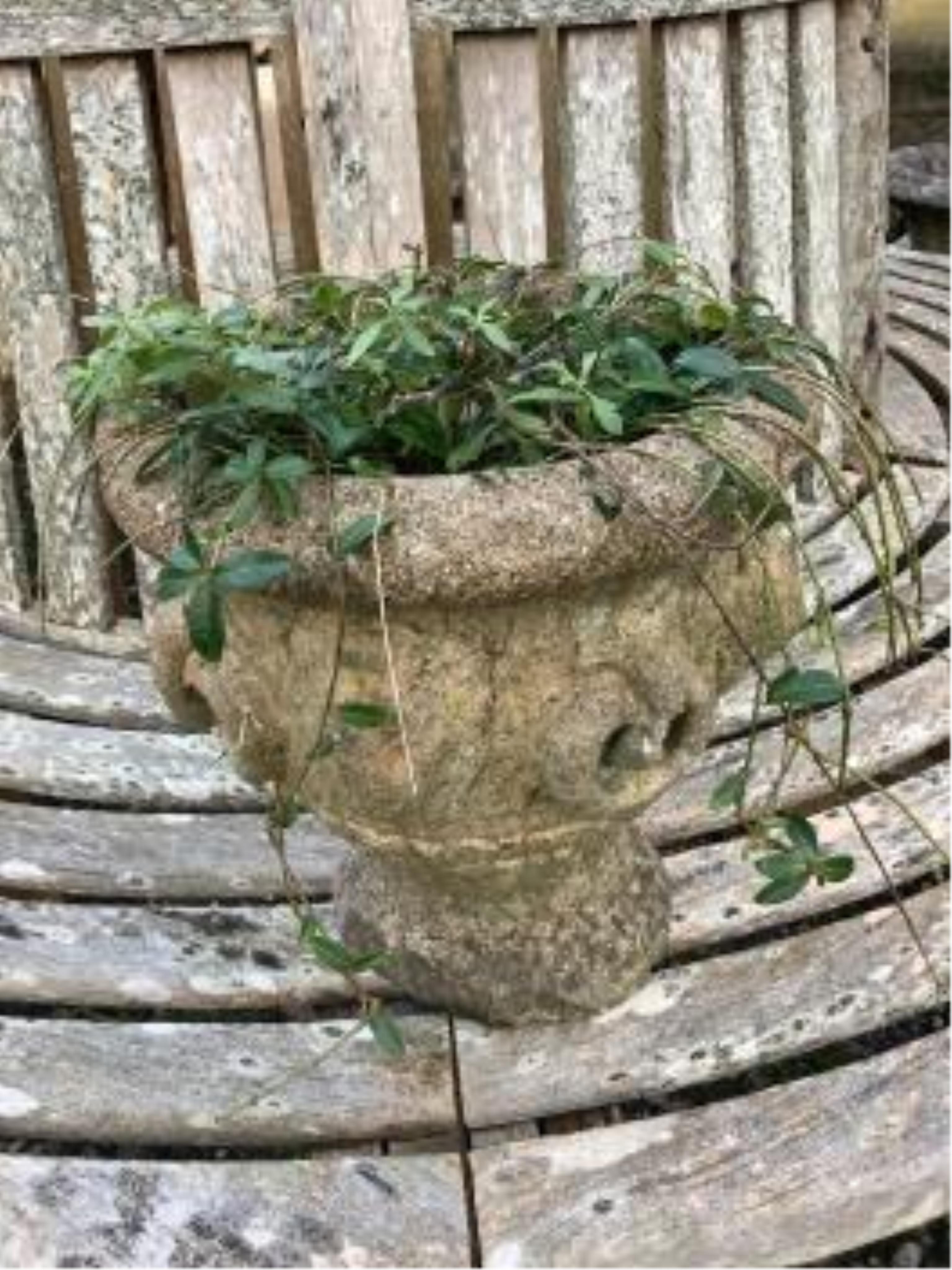 Three reconstituted stone circular garden planters and a square plinth. Condition - fair